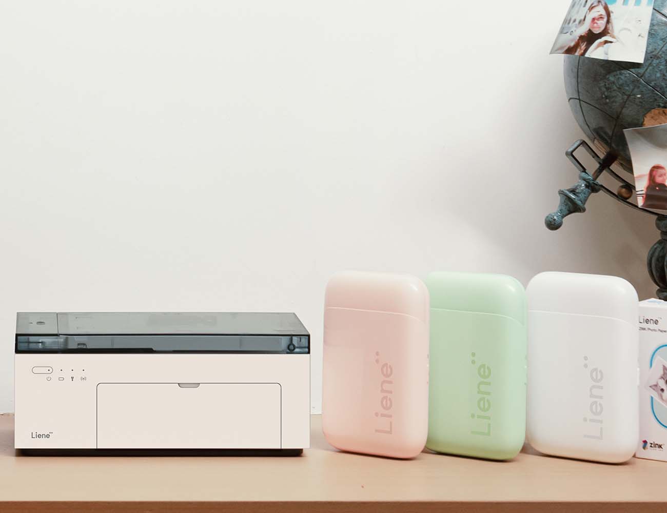 Liene’s Amber and Pearl series of photo printers are displayed on a table